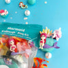 Mermaid-themed modeling clay play kit with figurines and accessories on a blue background