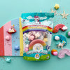 Unicorn-themed modeling clay play kit with colorful packaging on a blue background