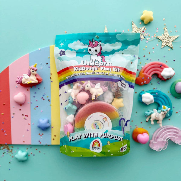 Unicorn-themed modeling clay play kit with colorful packaging on a blue background