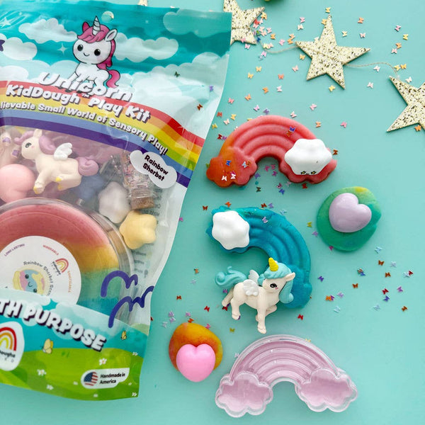 Unicorn-themed play dough kit with colorful play dough shapes on a turquoise background