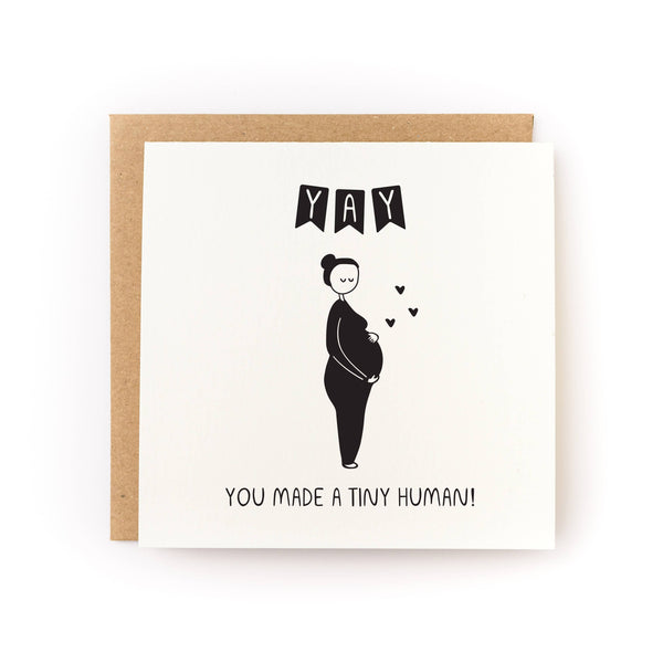 Greeting card with a black and white illustration of a pregnant person and text on a white background