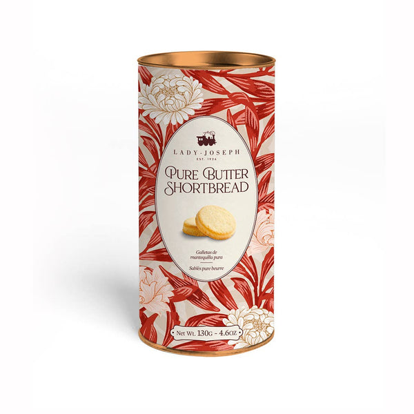 A tall cylindrical tin of Lady Joseph Pure Butter Shortbread cookies, featuring a red and cream floral pattern with a gold lid, set against a plain white background.