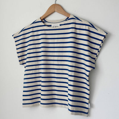 Blue and white striped shirt on a wooden hanger against a white background