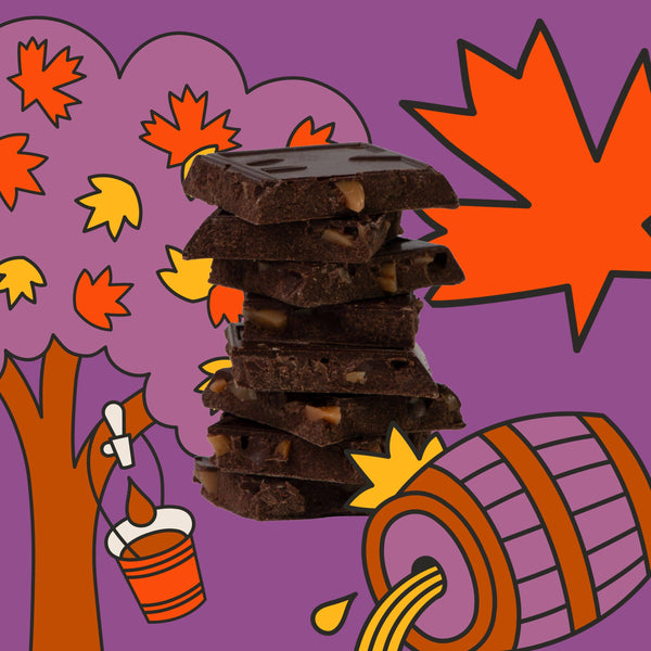 Stack of broken pieces of chocolate bar with autumn-themed elements on a purple background