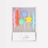 Set of colorful balloon-shaped birthday candles in a box on a white background