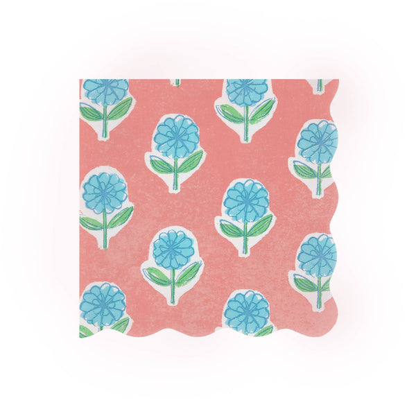 Wavy-edged paper napkin featuring a pattern of blue flowers with green stems on a pink background
