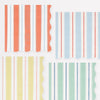 Set of colorful striped wavy-edged paper napkins in four different colors on a white background