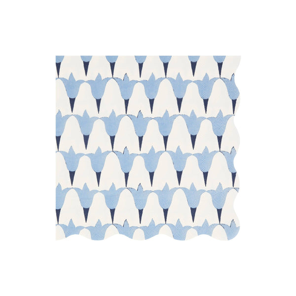 Patterned wavy-edged paper napkin with blue and white op art floral design on a white background