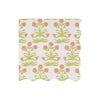 Floral patterned wavy-edged paper napkin with pink-orange flowers and green leaves on a white background