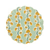 Decorative wavy-edge small plate with floral pattern on a light green background