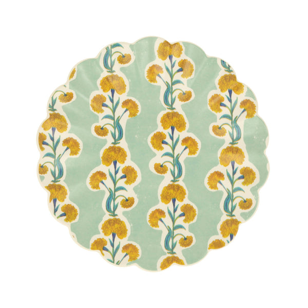 Decorative wavy-edge small plate with floral pattern on a light green background