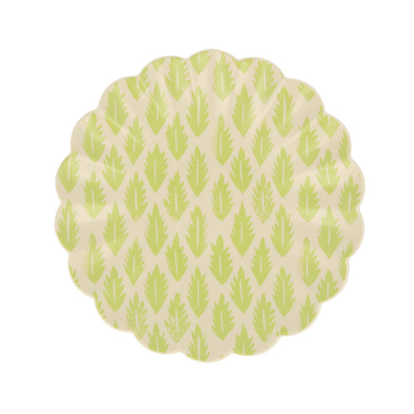 Small wavy-edged plate with a green leaf pattern on a white background