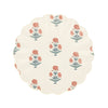 Round small plate with floral pattern and a wavy edge on a white background