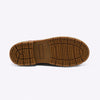 A bottom view of a treaded sole of a boot against a white backdrop.
