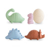 Set of colorful dinosaur-shaped bath toys on a white background