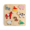 Wooden puzzle with farm animal figures on a beige background