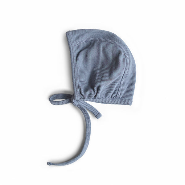 Blue baby bonnet on a white background