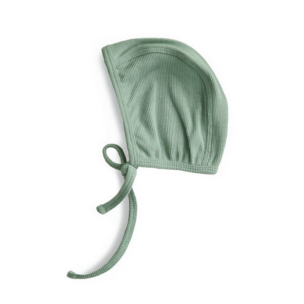 Green baby bonnet on a white background