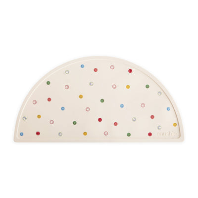 Half-circle silicone placemat with colorful smiley face pattern on a white background