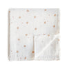 A white and light brown sparrow print muslin cotton baby swaddle blanket folded on a white background.