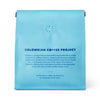 Blue coffee package with text about the Colombian Coffee Project on a white background