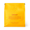Yellow coffee bag labeled 'Jumpstart' with text on a white background