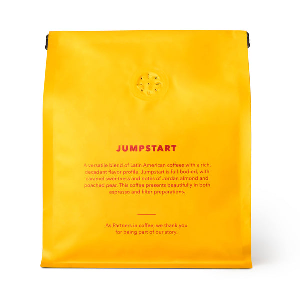 Yellow coffee bag labeled 'Jumpstart' with text on a white background