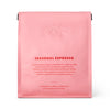 Pink packaging of Seasonal Espresso with text on a white background