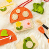 A white fur rug backdrop laid out with a felt craft kit for a toadstool purse and bag charm, along with embroidery floss and a kid-safe needle. 