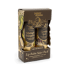 Poppy & Pout 'Practical Magic' Lip Balm Sister Pack containing Midnight Margarita and Garden Spell lip balms in a brown cardboard box with gold lettering.