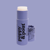 A lavender lip balm stick with its cap removed and standing beside it on a matching lavender background. The balm stick has a pale cream-colored balm tip and black text reading 'poppy & pout' and 'wild Berry'.