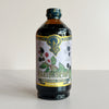 A bottle of Marionberry Premium Beverage Concentrate syrup, featuring a purple label with marionberry illustrations and a gold and blue logo, set against a plain light background.