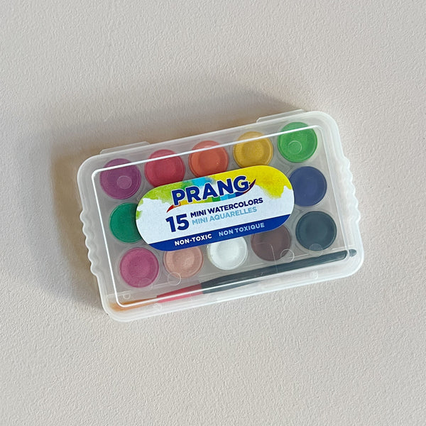 A mini kit of fifteen different watercolor pigments and a mini paintbrush in a clear plastic case with 'Prang' branding info. 