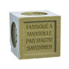 Cube-shaped dark green olive oil soap with 'Fabriqué Marseille par Maitre Savonnier' text on a white background