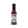 Hot sauce bottle with label featuring a tiger and green leaves on a white background
