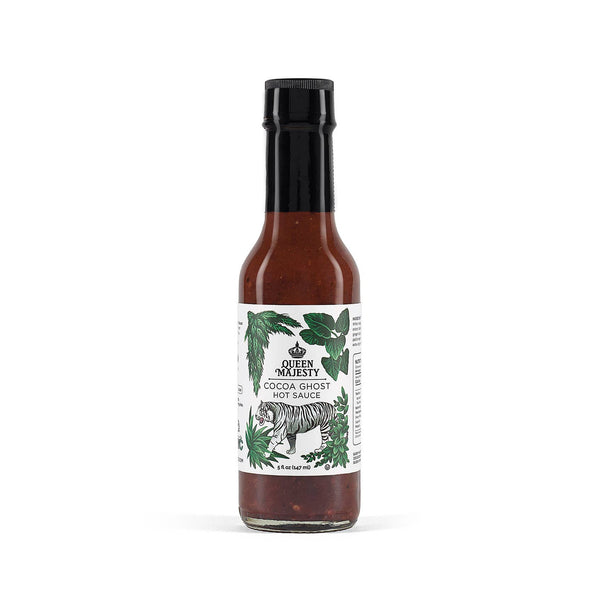 Hot sauce bottle with label featuring a tiger and green leaves on a white background