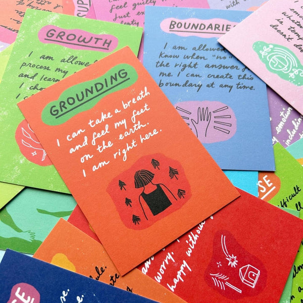 Colorful affirmation cards with text and illustrations on a colorful background