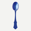 A large blue acrylic serving spoon against a white background.