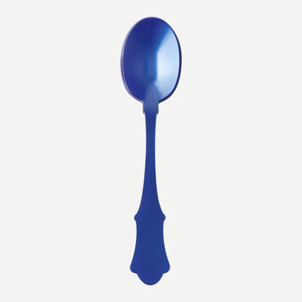 A large blue acrylic serving spoon against a white background.