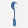 A large light blue acrylic serving spoon against a white background.