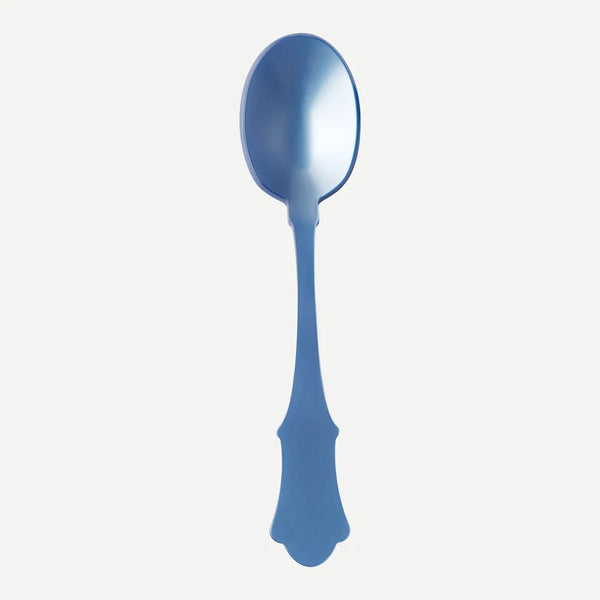 A large light blue acrylic serving spoon against a white background.