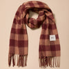 A large lambswool fringed scarf in a rich fig and warm tan gingham pattern against a neutral background.