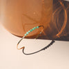 Bracelet with green chrysoprase beads on a neutral background