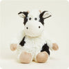 Plush cow toy on a white background