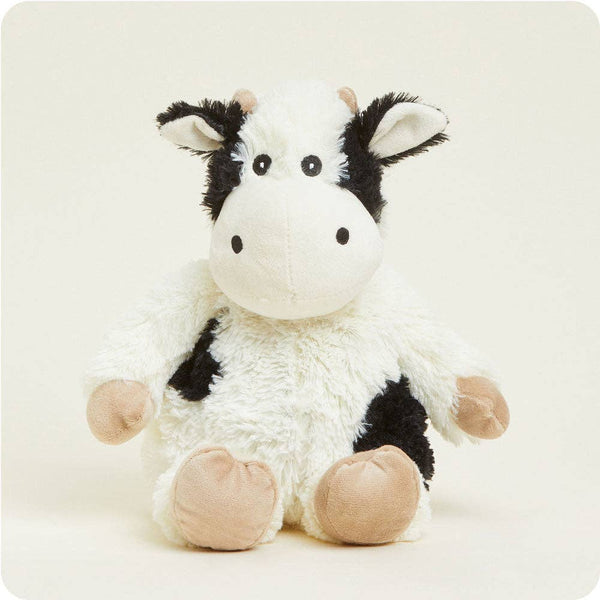 Plush cow toy on a white background