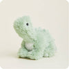 A light mint green plush dinosaur toy with a small white chest patch and a black bead eye, sitting on a warm off-white background.