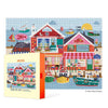 Jigsaw puzzle box with a colorful coastal scene design on a white background