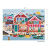 Colorful puzzle of a coastal scene with buildings and boats, featuring dimensions 27" x 20".