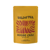 Yellow package of Wild & Tea House Chai black tea with red leaf design on a white background