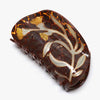 Decorative hair claw with tortoiseshell pattern and floral design on a white background